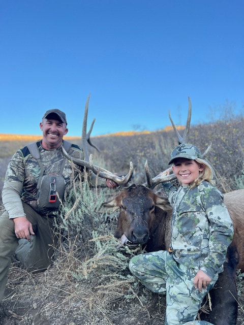 Mentor and young participant with an elk — healing through guided outdoor adventure