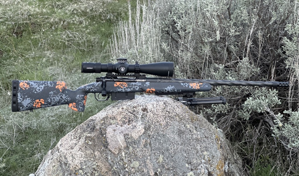 Rifle Raffle rifle shown side profile on a rock.